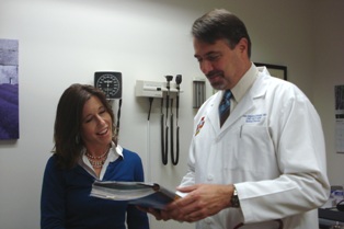 John Fullerton, MD with a patient